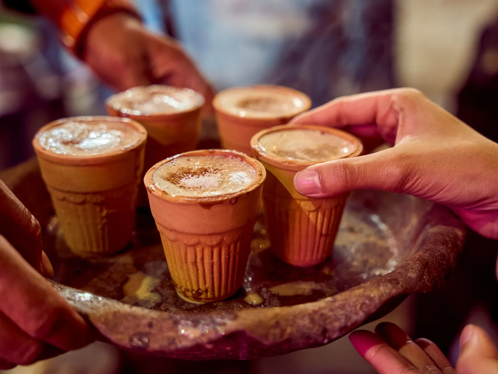 Steaming masala chai served in traditional clay kulhad cups